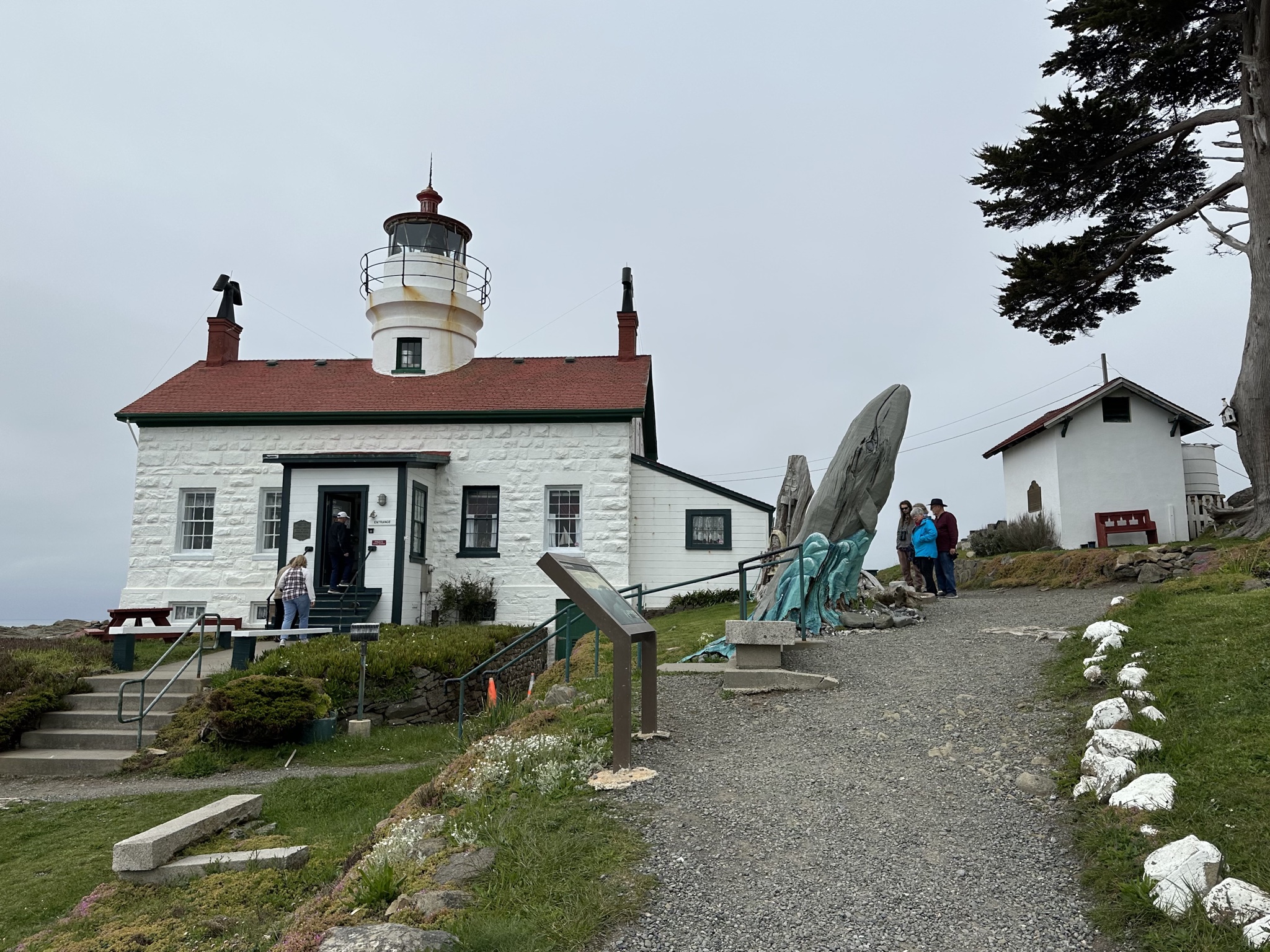 Lighthouse building with some people