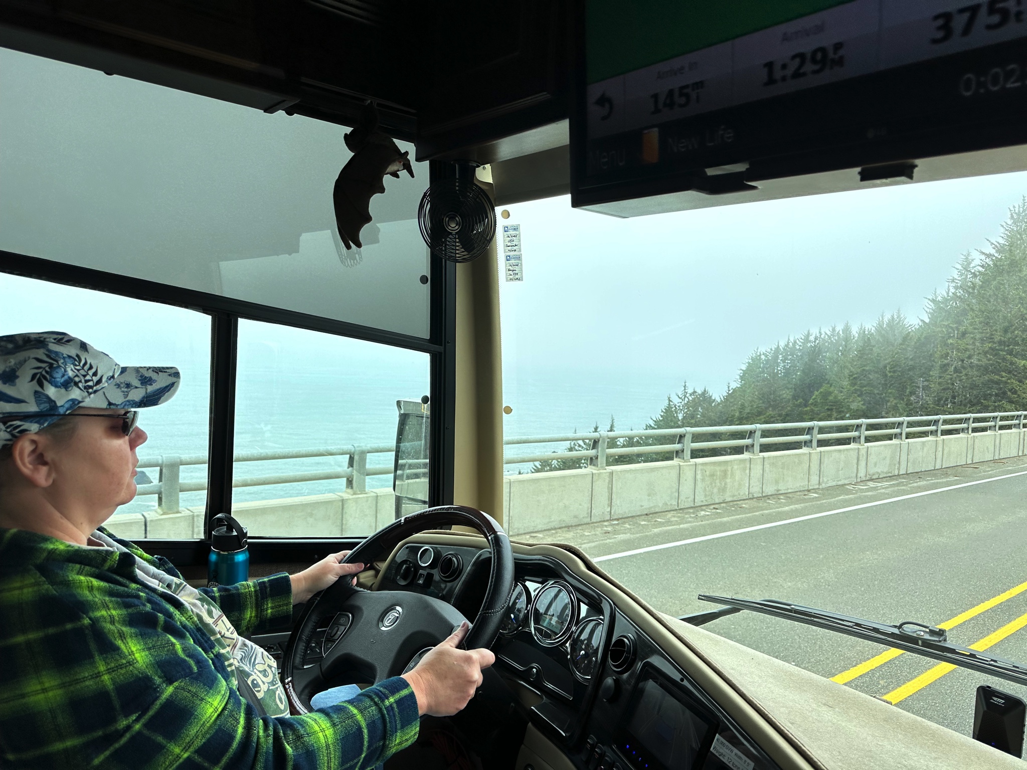 Jenn driving our motorhome by the coast