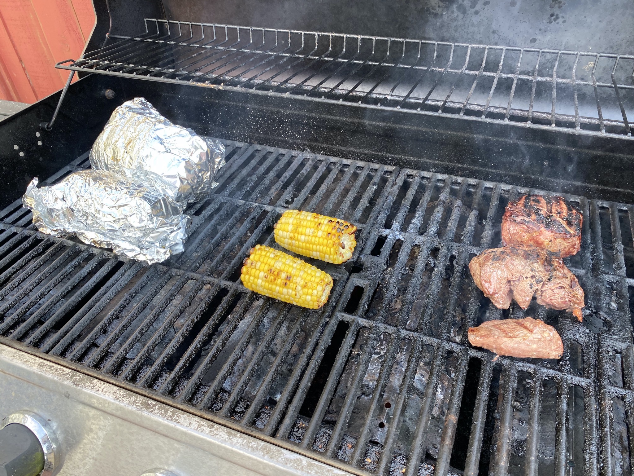 Grilling potatoes, corn, bison steaks