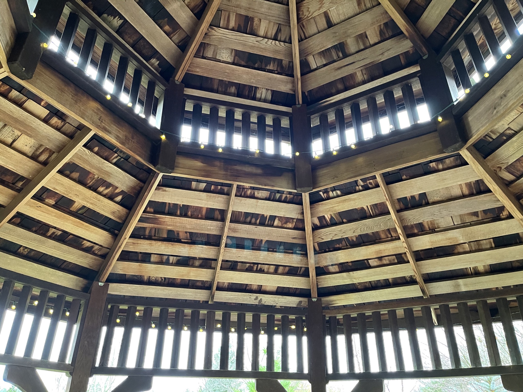 Looking up in the brown gazebo
