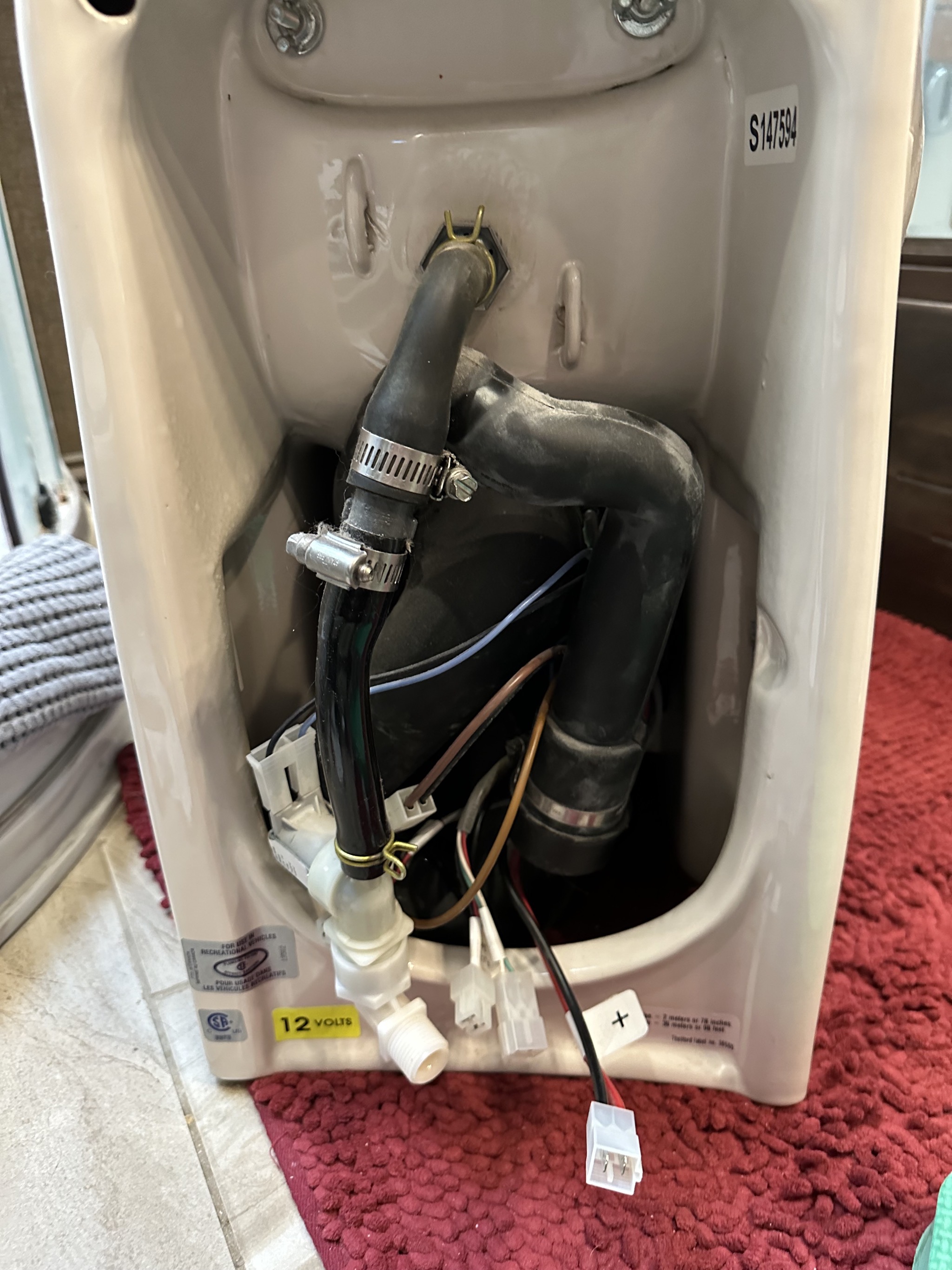 Macerating toilet