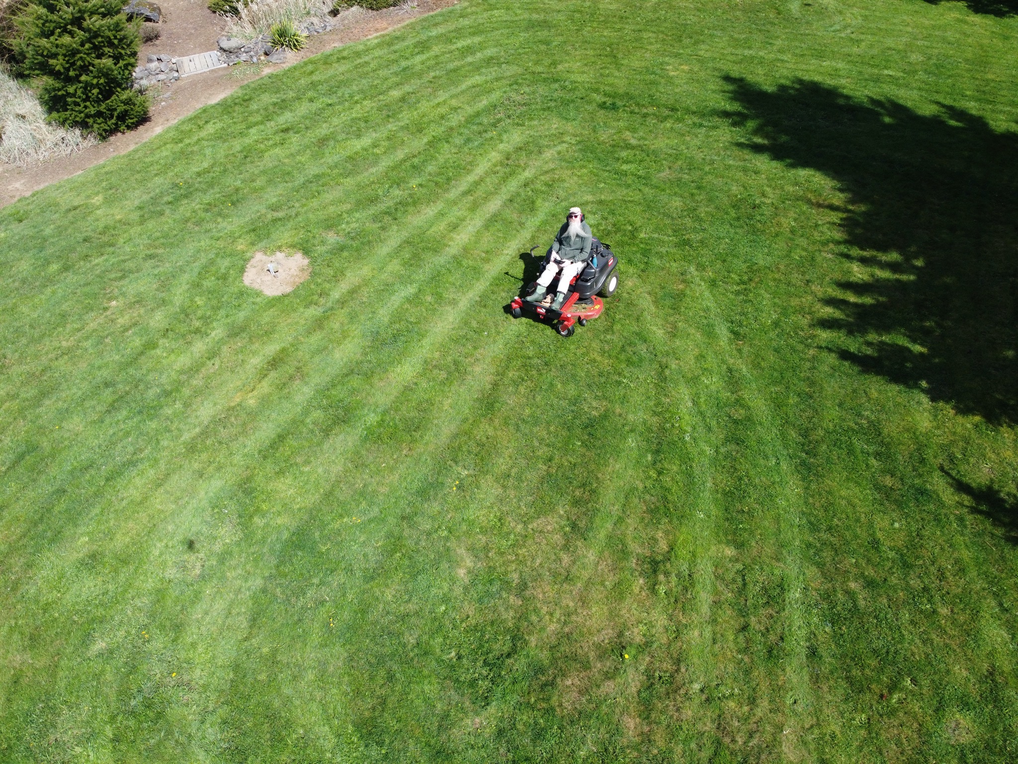 Drone shot of David on mower