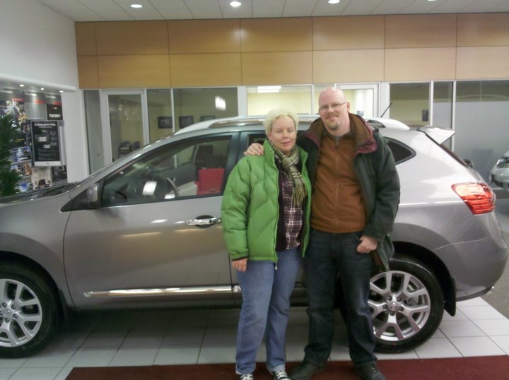 Jenn and David in front of new car