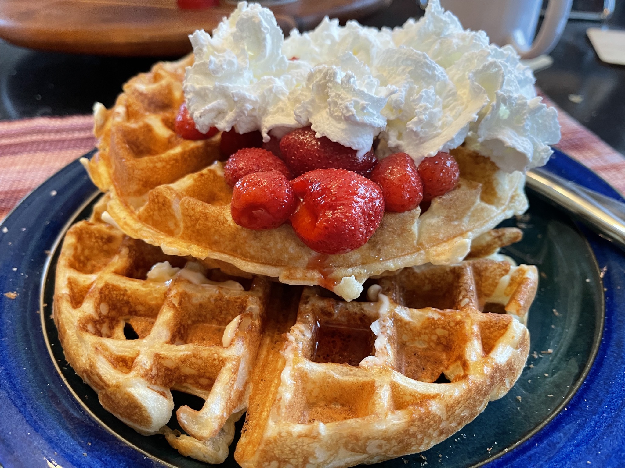 Sourdough waffles with strawberries and whipped cream