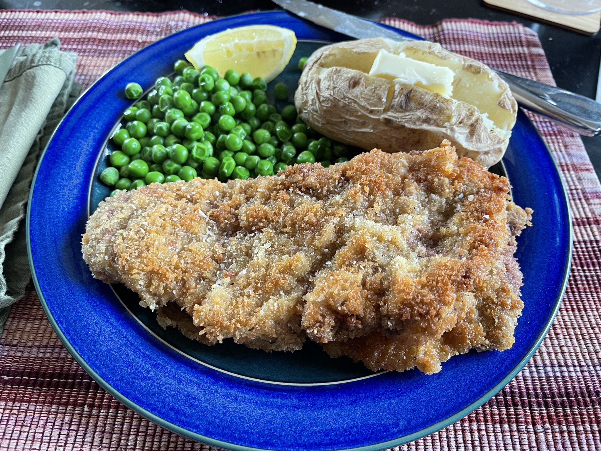 Schnitzel, baked spud, peas for dinner
