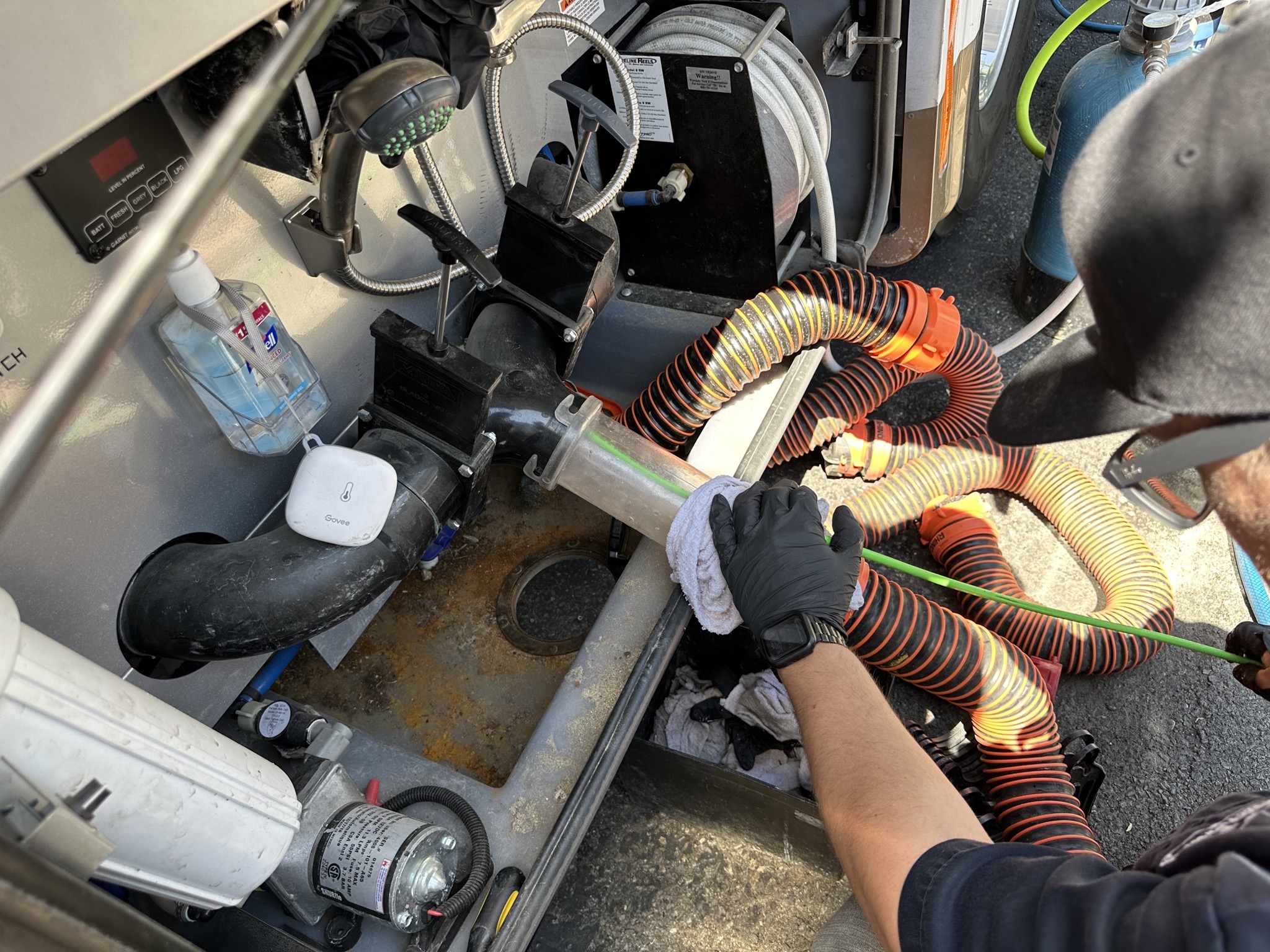 Professionally cleaning gray and black tanks