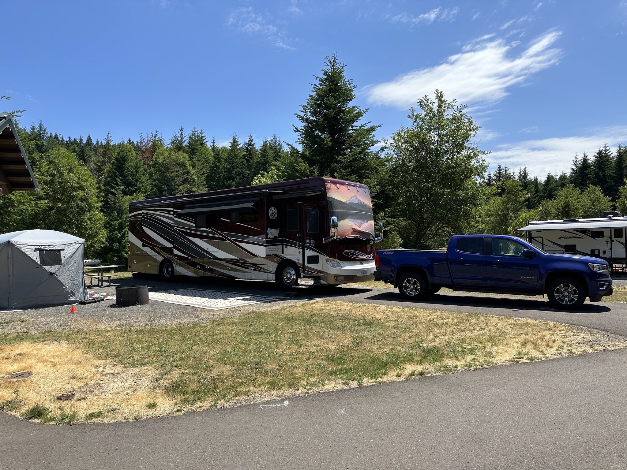 Campsite with motorhome and truck
