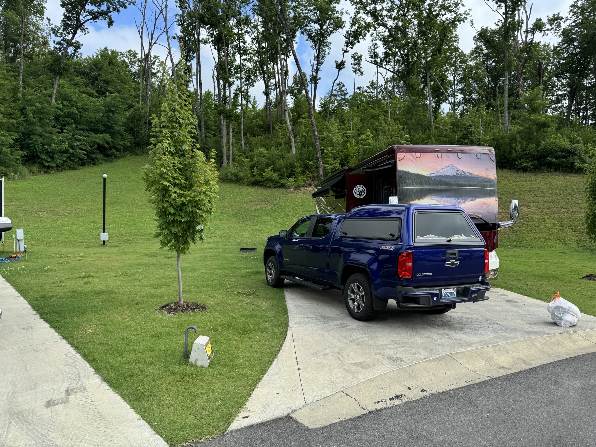 Motorhome and truck in campsite